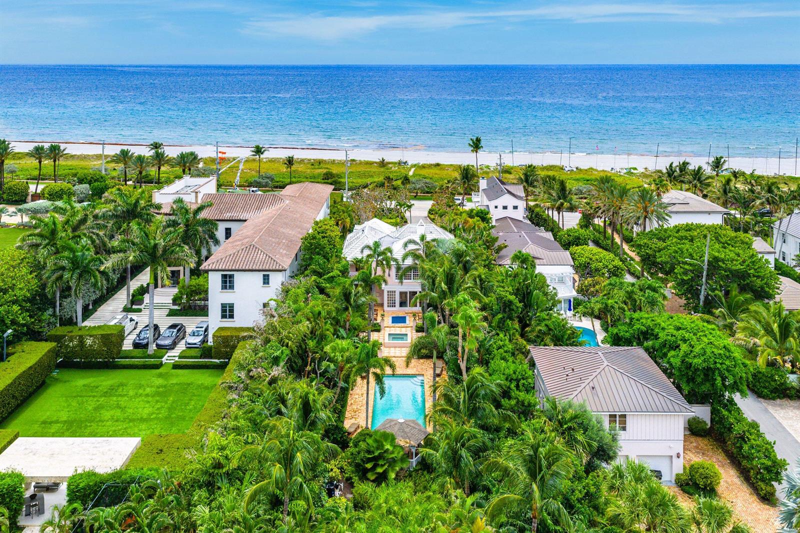 An aerial view of a coastal property featuring a swimming pool, lush landscaping, and houses — 406 N Ocean Boulevard, Delray Beach FL 33483, DELRAY BEACH, FL