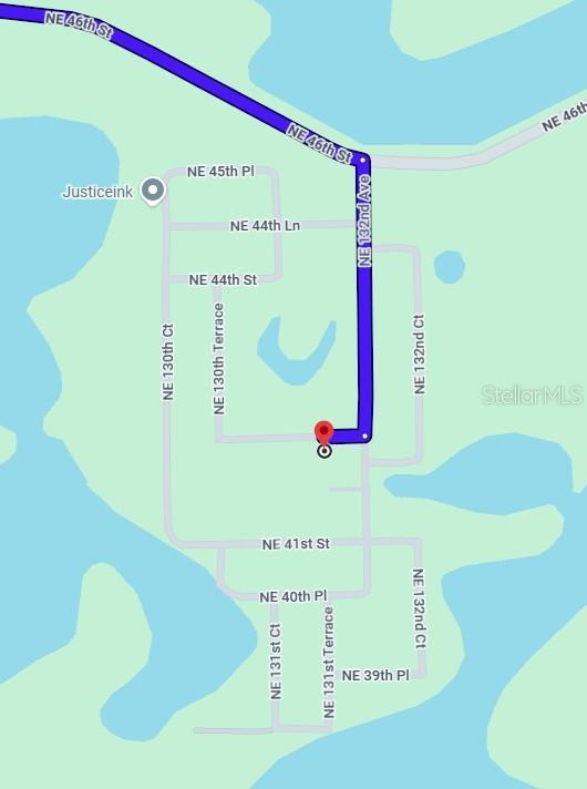 This is a map showing a property location and driving route in a residential neighborhood — NE 41ST PLACE, SILVER SPRINGS, FL