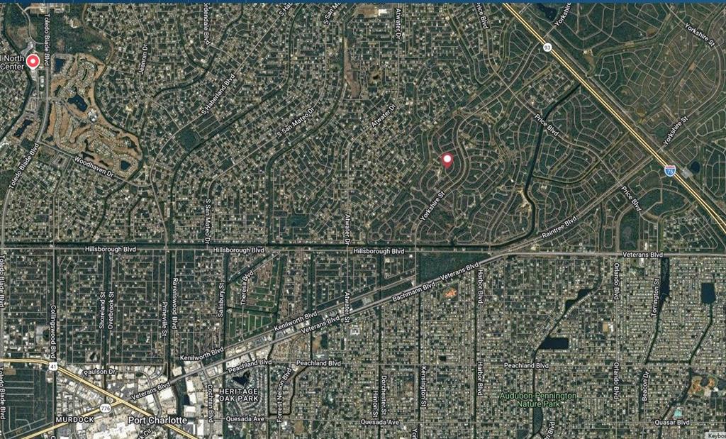 This is an aerial map view of a residential neighborhood in Port Charlotte, Florida — PATRIOT CIRCLE, NORTH PORT, FL
