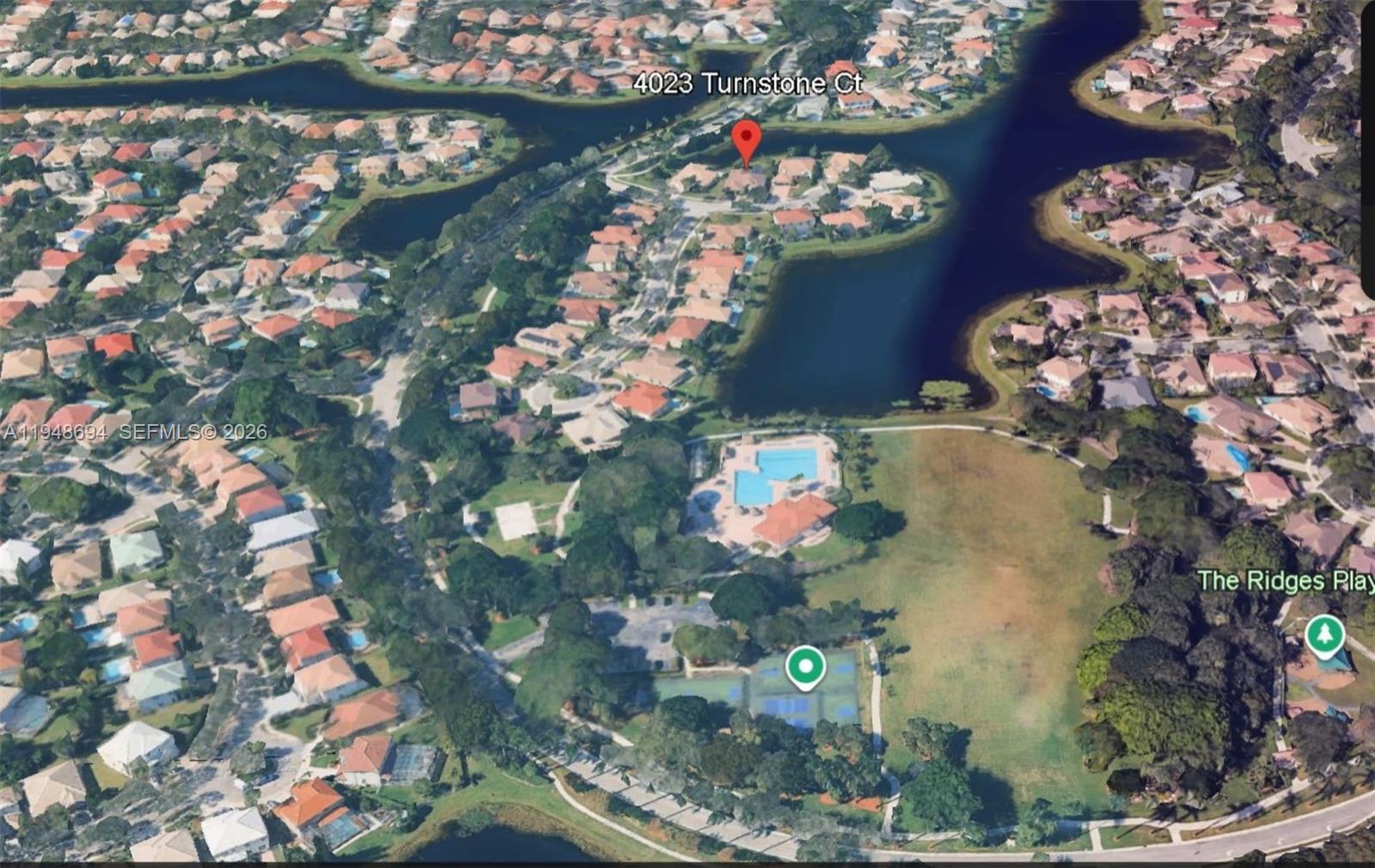 This aerial map shows a residential neighborhood with a lake, community pool, and tennis courts — 4023 Turnstone Ct # 4023, Weston FL 33331, WESTON, FL