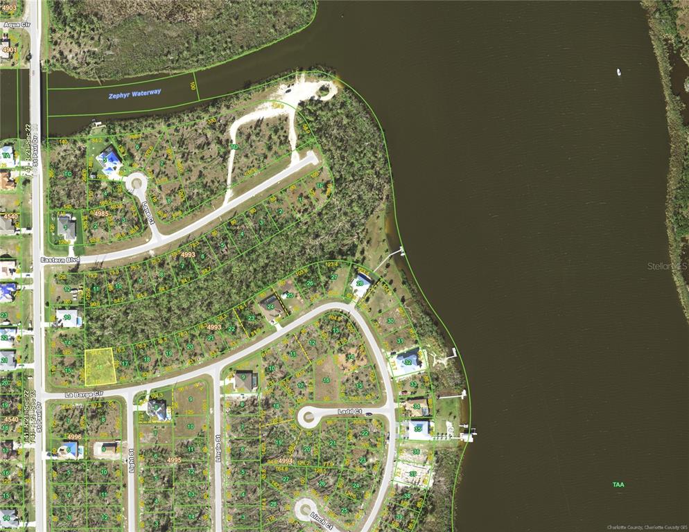 This is an aerial map showing residential lots, streets, and a waterway in Florida — 16024 LA BARGE CIRCLE, PORT CHARLOTTE, FL