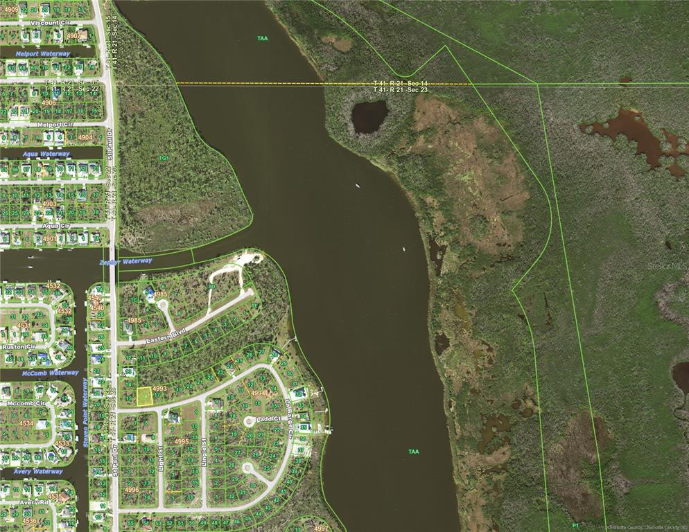 This is an aerial map showing residential lots, waterways, and undeveloped land — 16024 LA BARGE CIRCLE, PORT CHARLOTTE, FL