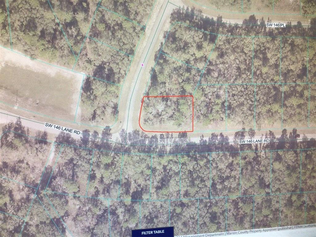 An aerial map shows a rectangular plot of land outlined in red near a road — 0 SW 145 PLACE ROAD, OCALA, FL