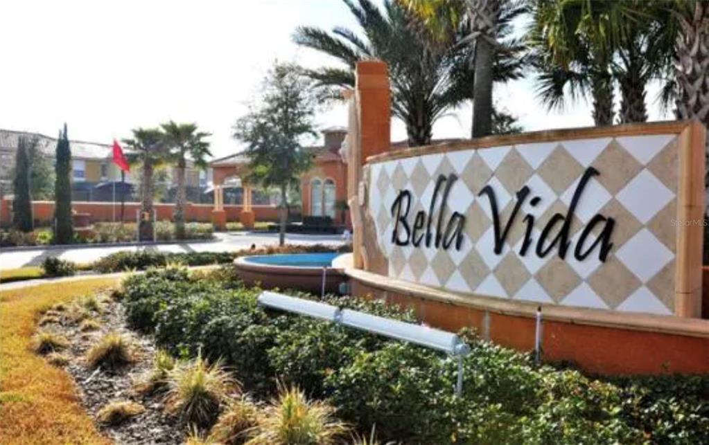 A stone monument sign with the words Bella Vida stands in front of a gated community — 890 MARCELLO BOULEVARD, KISSIMMEE, FL