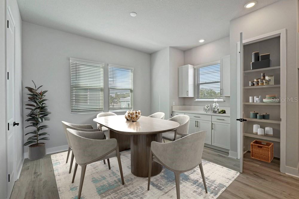 A dining room features a pedestal table, six chairs, a built-in buffet, and a pantry — 89 28TH STREET S, ST PETERSBURG, FL