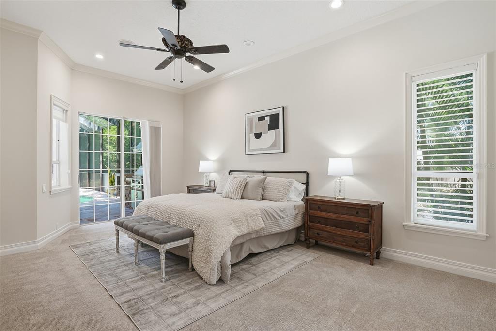 A bathroom features a glass-enclosed shower, a corner soaking tub, and a white vanity — 777 CATTAIL COURT NE, ST PETERSBURG, FL