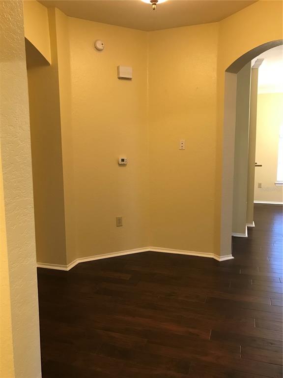 A carpeted staircase with a white handrail leads upward from a tiled entryway — 180 VILLA DI ESTE TERRACE UNIT 212, LAKE MARY, FL