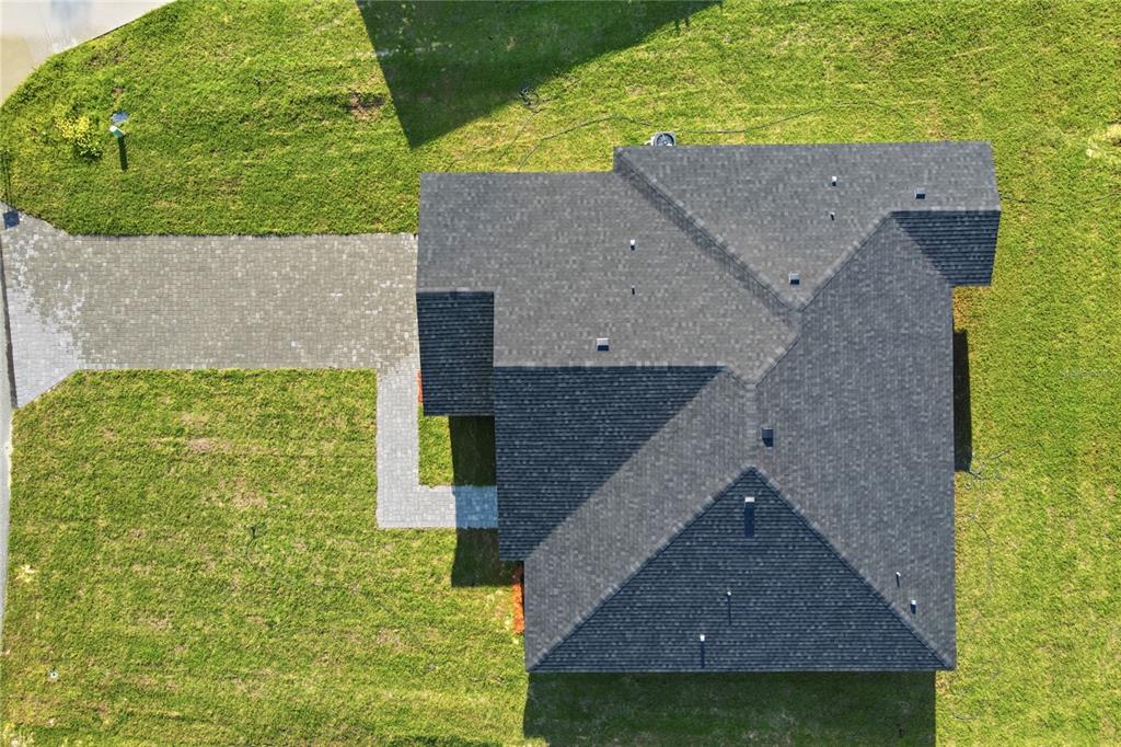 An aerial view shows a house with a dark shingled roof and a paved walkway — 13695 SW 40TH CIRCLE, OCALA, FL