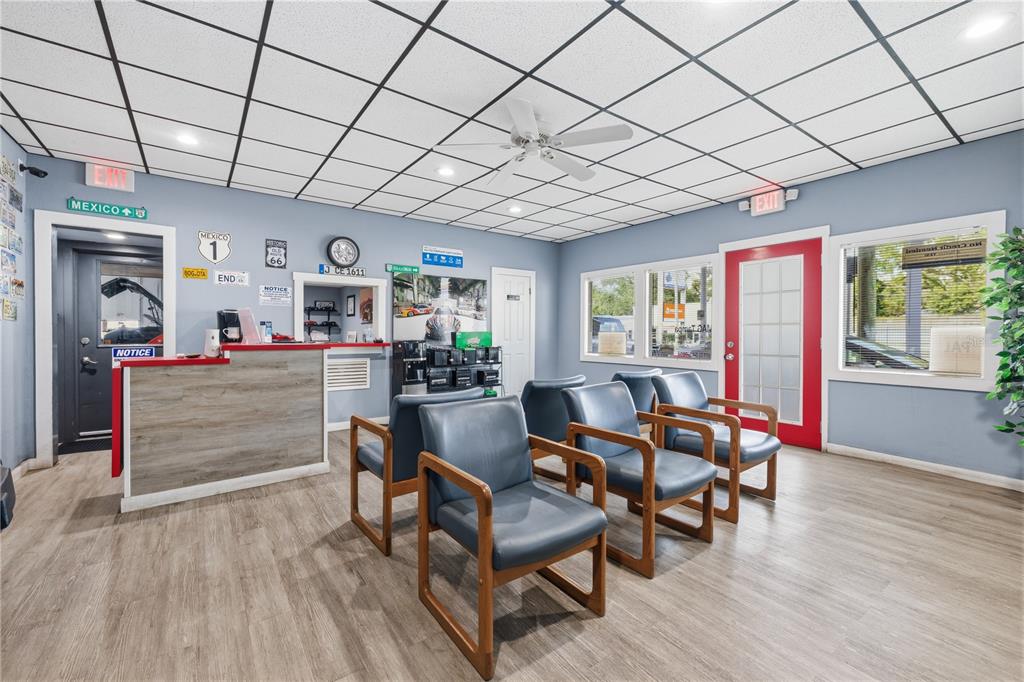 A waiting room features blue chairs, a reception desk, and a drop ceiling — 6200 N NEBRASKA AVENUE, TAMPA, FL