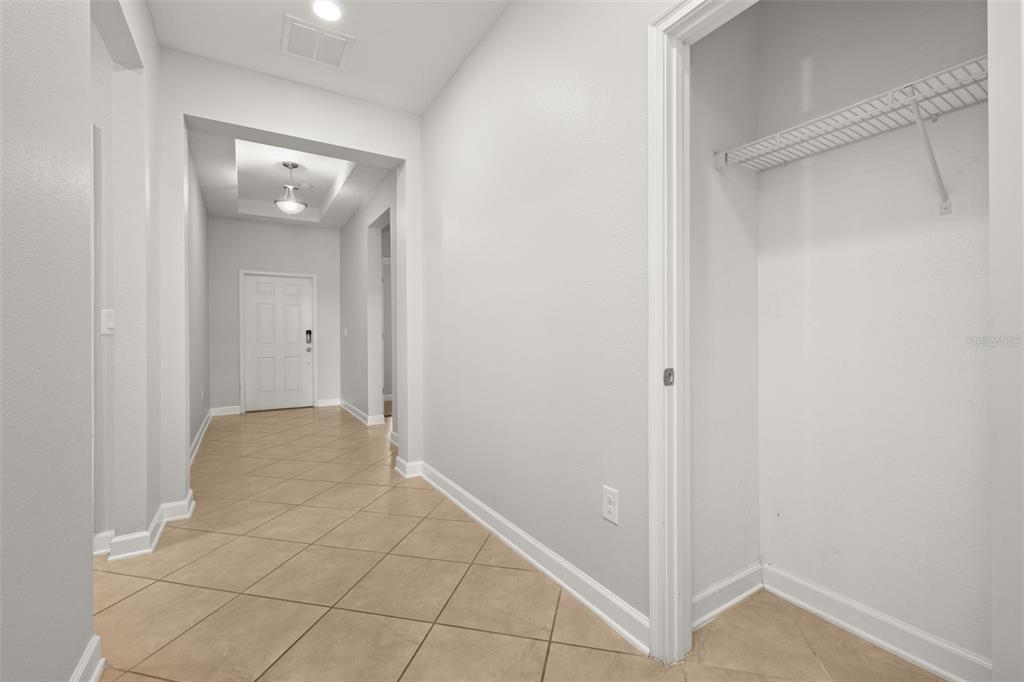 A tiled entryway leads to a front door with a closet on the right — 14157 GOLD BRIDGE DRIVE, ORLANDO, FL
