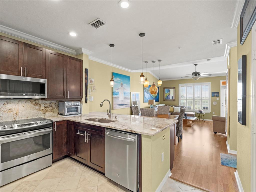 An aerial view shows a multi-story waterfront condominium complex with a boat dock — 5000 CULBREATH KEY WAY UNIT 9-301, TAMPA, FL