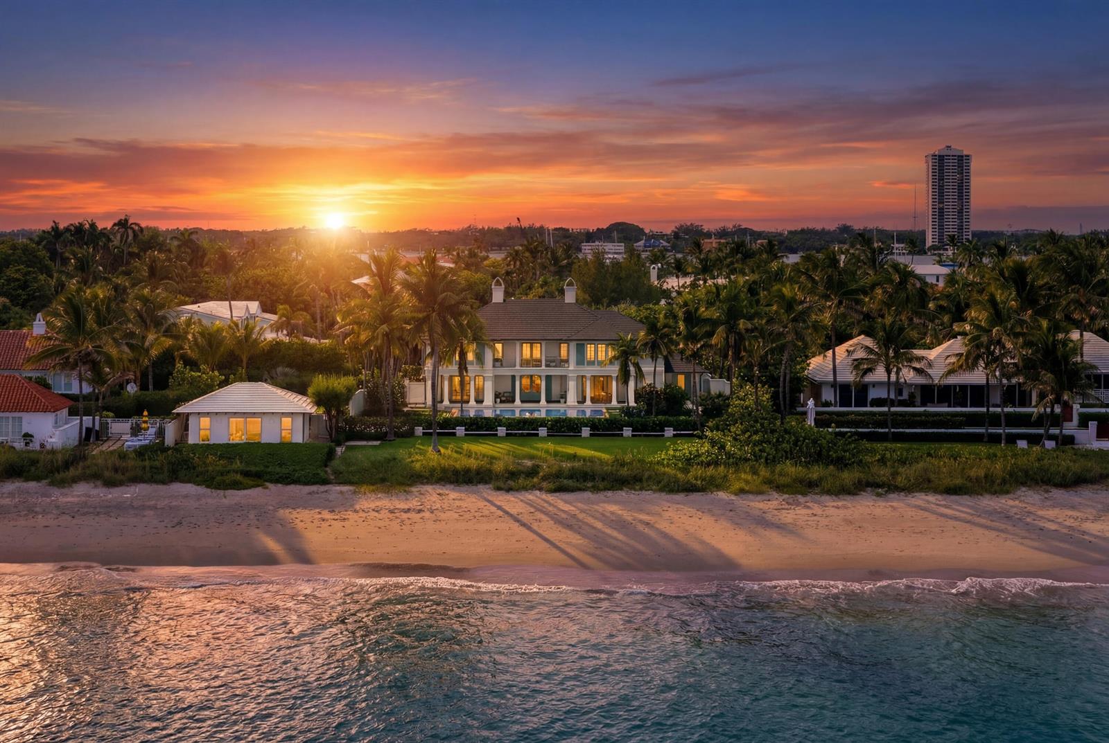 An aerial view of a beachfront house with a pool at sunset — 1285 N Ocean Boulevard, Palm Beach FL 33480, PALM BEACH, FL