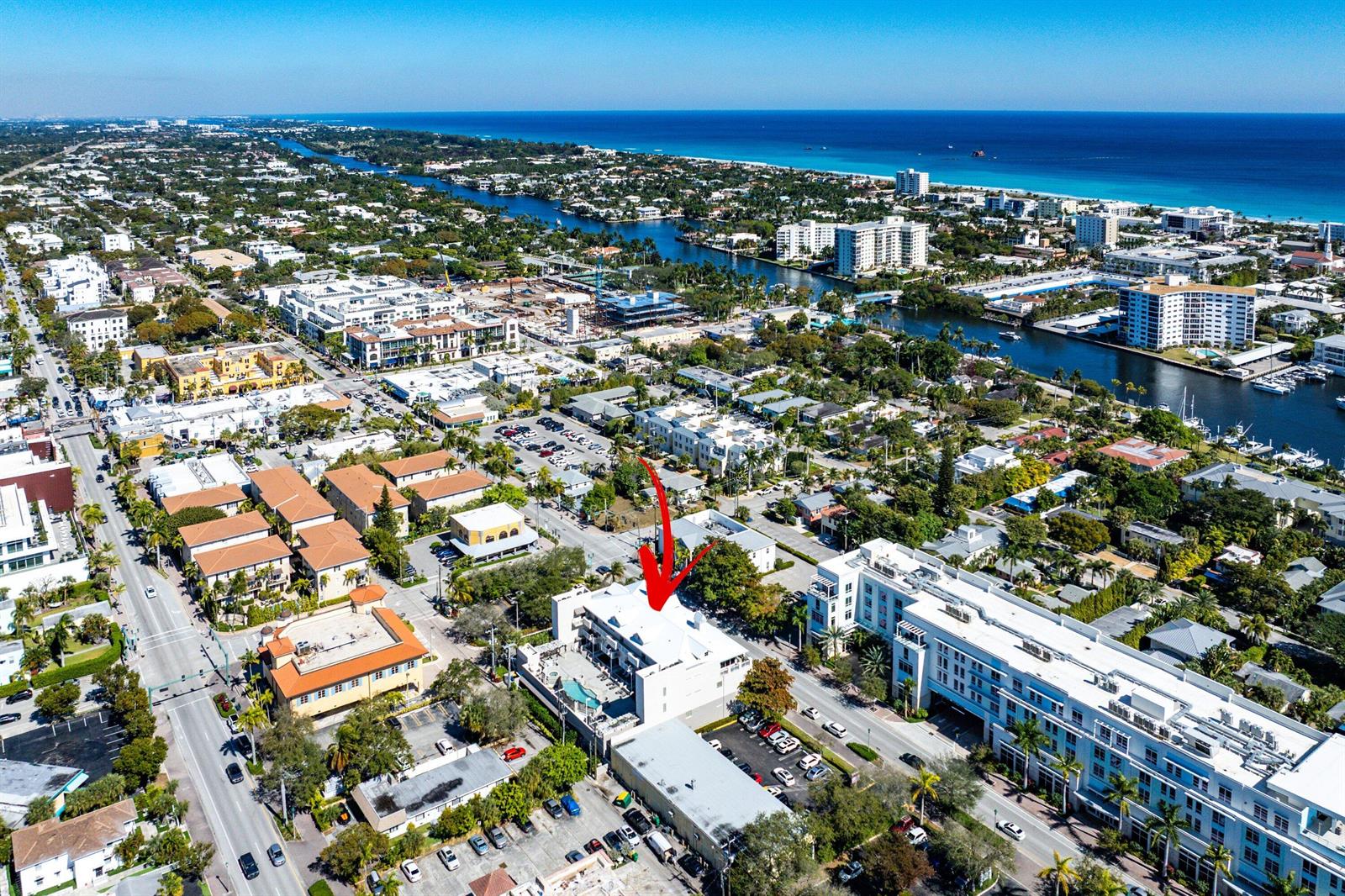 An aerial view of a multi-story white building with a red arrow pointing down — 122 SE 6th Avenue # 3, Delray Beach FL 33483, DELRAY BEACH, FL
