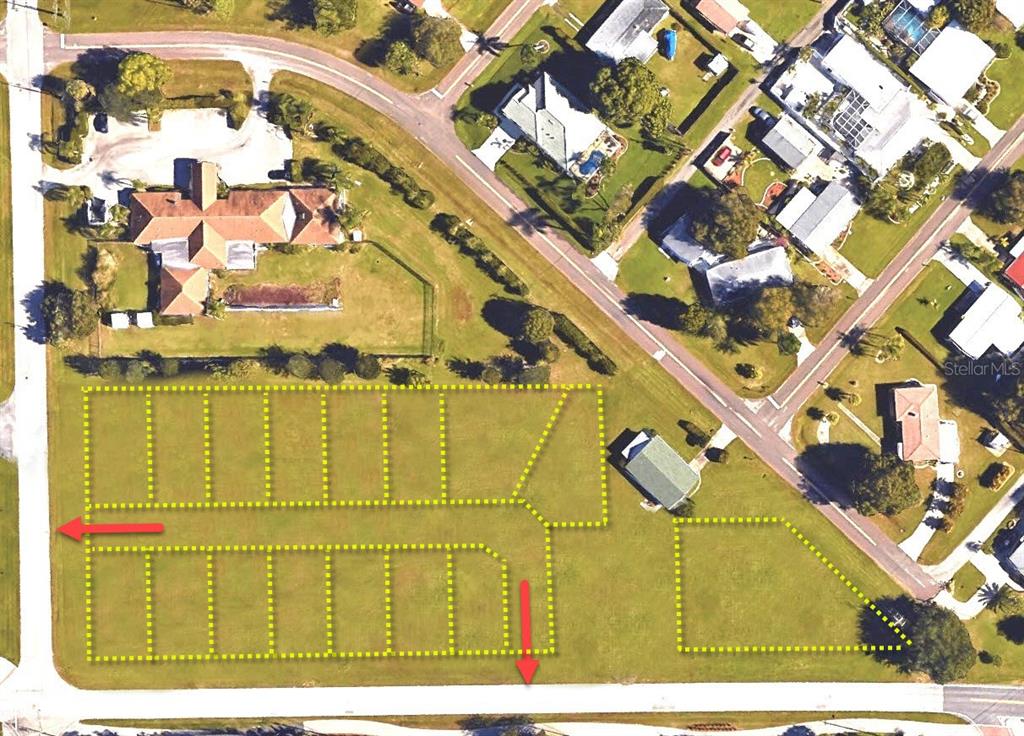This aerial map shows a vacant land parcel outlined in yellow with two red arrows — 512 SHREVE STREET, PUNTA GORDA, FL
