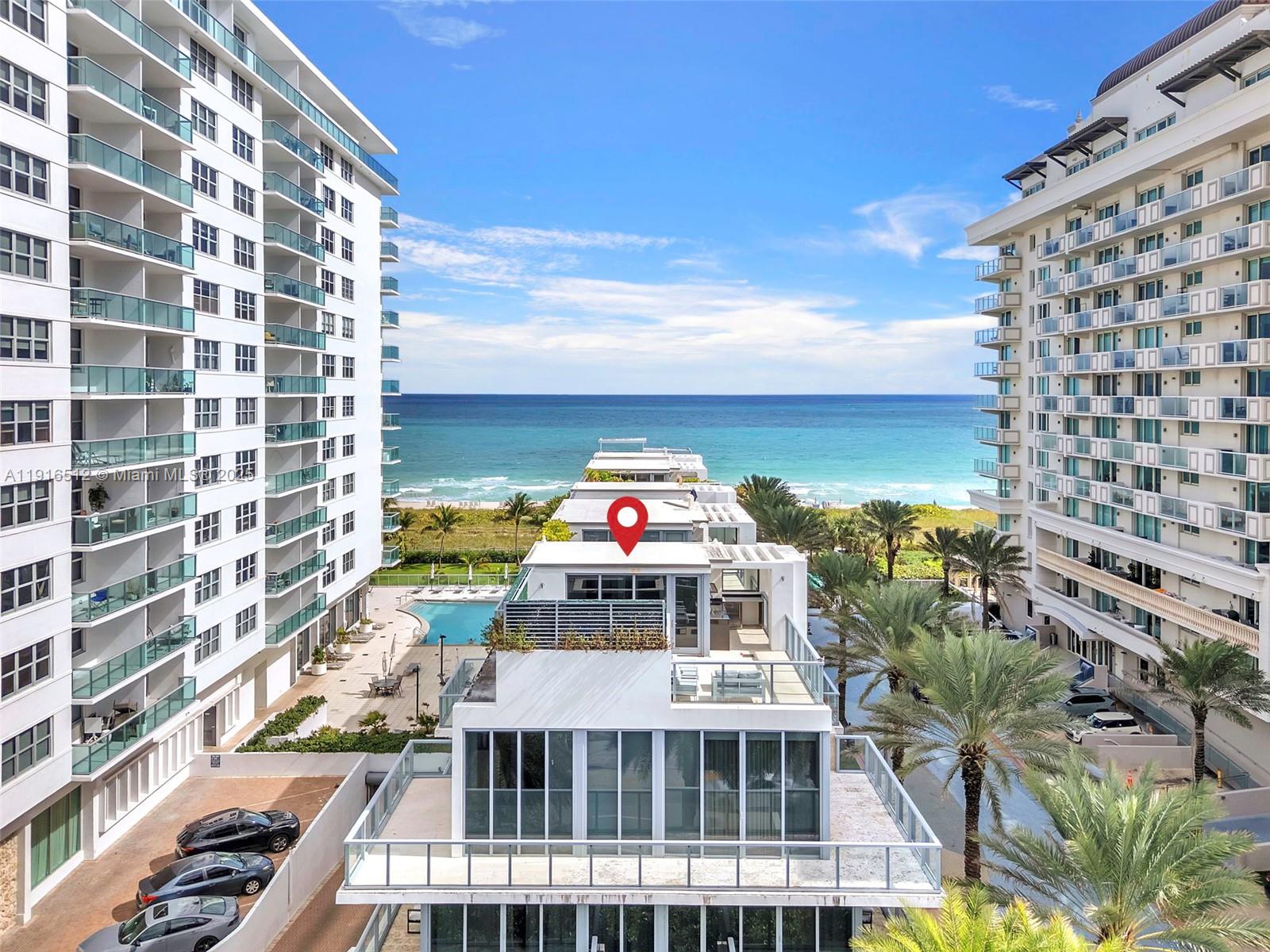 An exterior view shows a multi-story building with a red location pin overlooking the ocean — 9501 Collins Ave # 1, Surfside FL 33154, SURFSIDE, FL