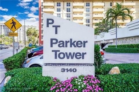A sign for Parker Tower stands in front of a multi-story building and landscaping — 3140 S Ocean Dr # 1210, Hallandale Beach FL 33009, HALLANDALE BEACH, FL