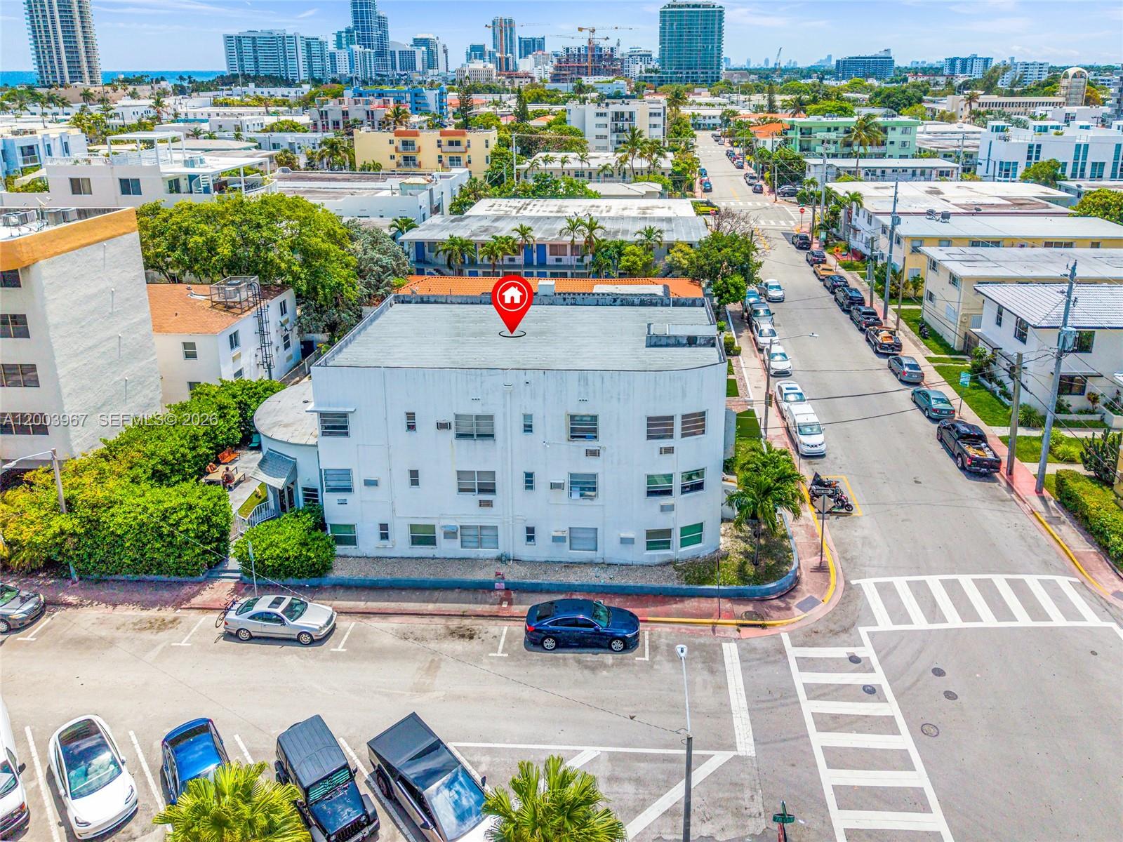 An aerial view shows a multi-story white apartment building with a red location marker — 420 78th St, Miami Beach FL 33141, MIAMI BEACH, FL