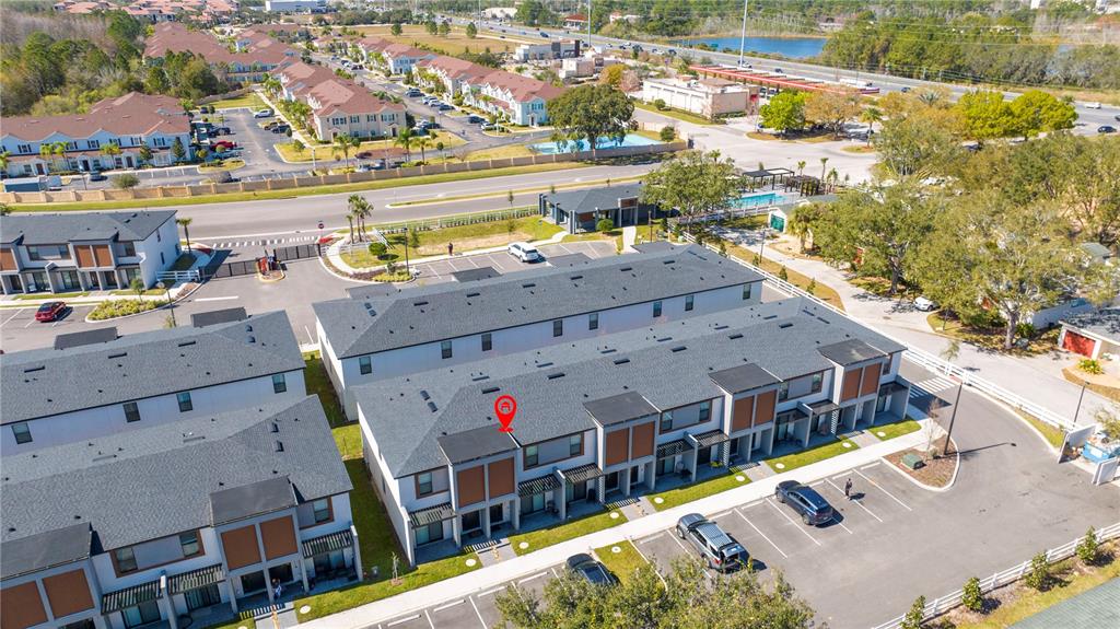 An aerial view shows a multi-unit townhouse complex with a red location marker — 3389 TRANQUIL TRAIL, KISSIMMEE, FL