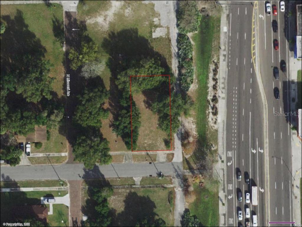 This is an aerial map view of a vacant, rectangular lot outlined in red — 115 W MYRTLE STREET, LAKELAND, FL