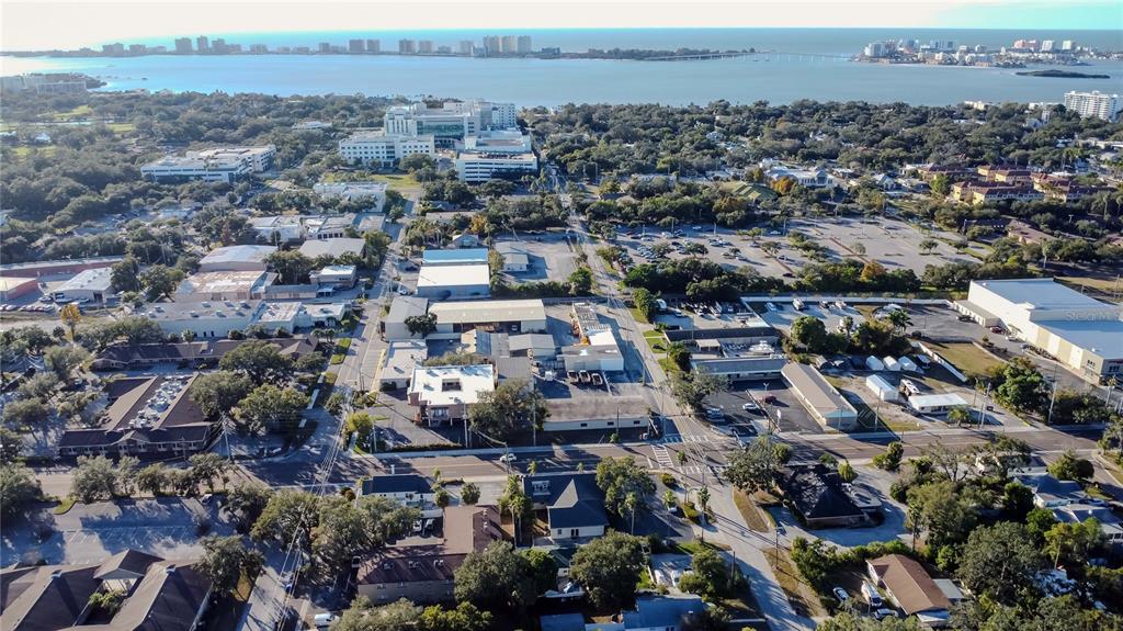 An aerial view shows a commercial and residential area near a body of water — 1201 S MYRTLE AVENUE, CLEARWATER, FL