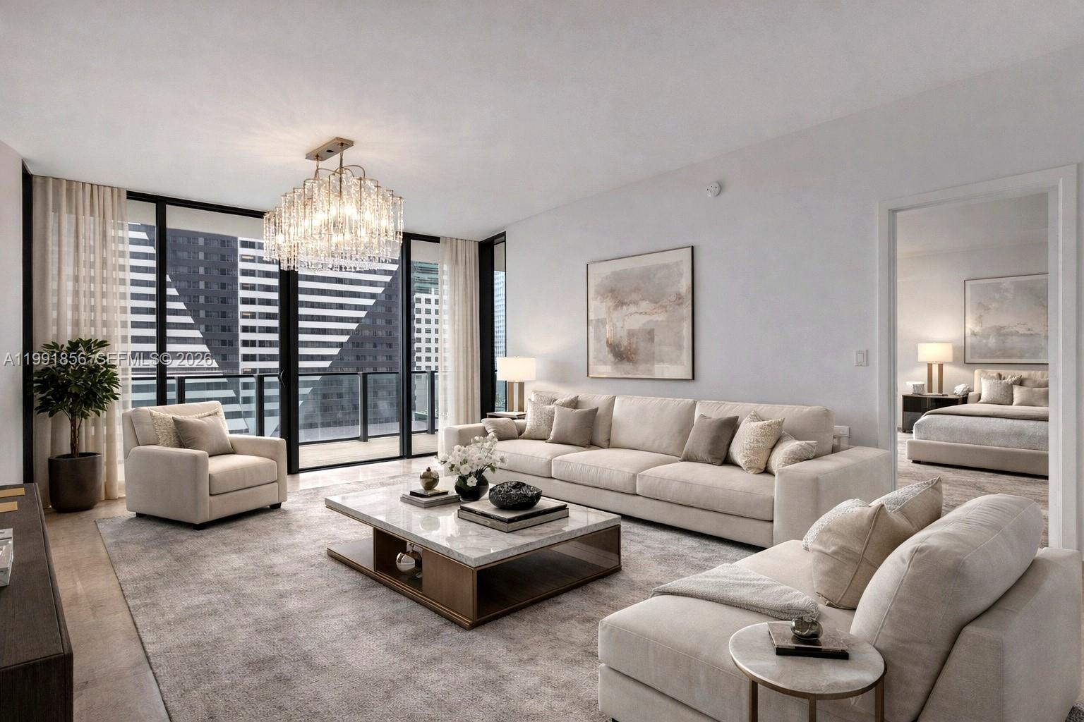 A modern living room features a cream sofa, marble coffee table, and floor-to-ceiling windows — 88 SW 7th St # 904, Miami FL 33130, MIAMI, FL