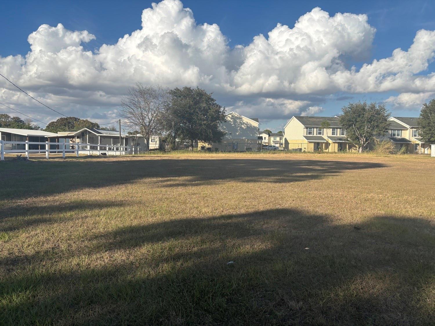 This is an aerial map view showing a plot of land near apartment complexes — 631 SE Us Highway 441, Okeechobee FL 34974, OKEECHOBEE, FL