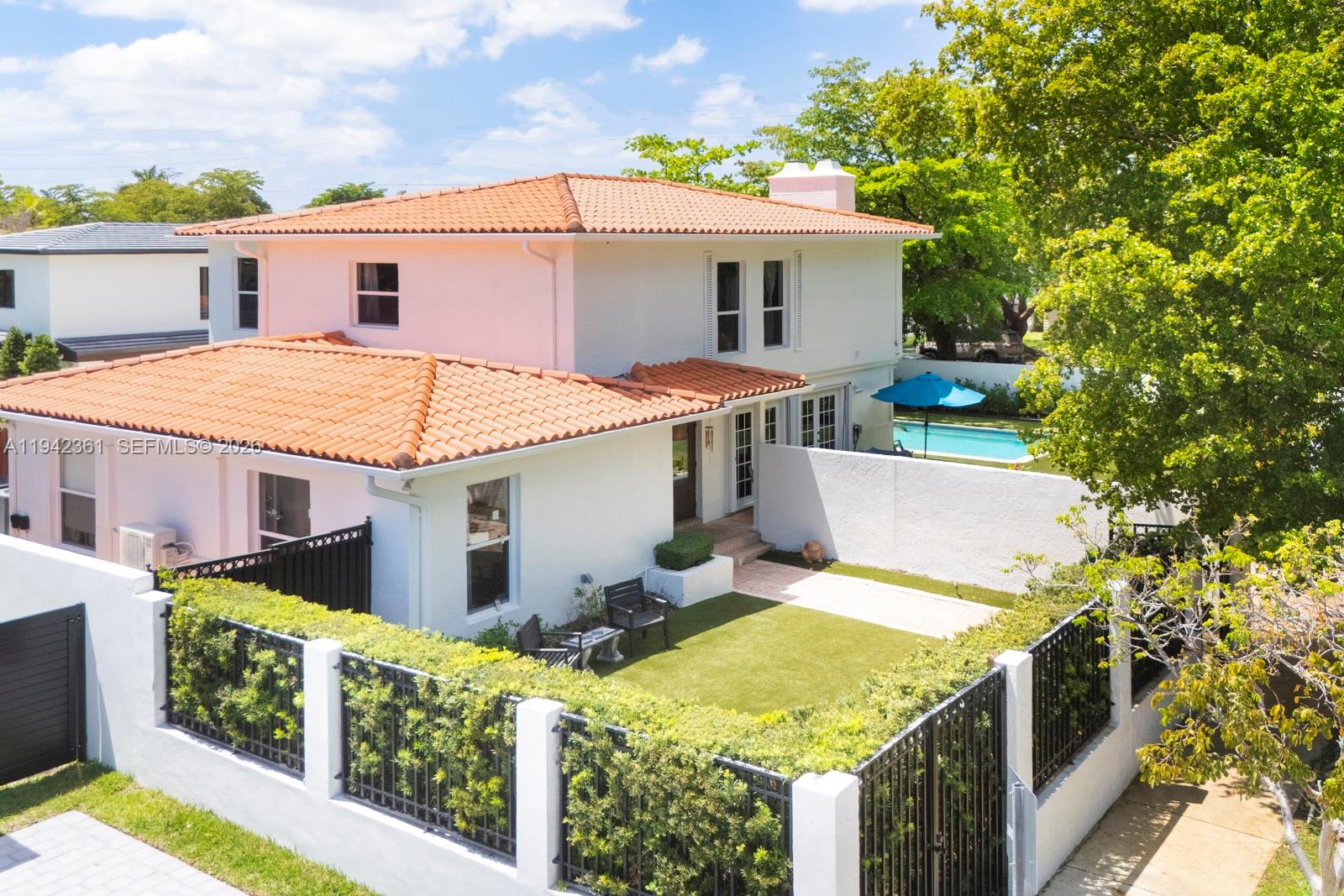 An aerial view shows a two-story house with a tiled roof, pool, and fenced yard — 360 SW 28th Rd, Miami FL 33129, MIAMI, FL