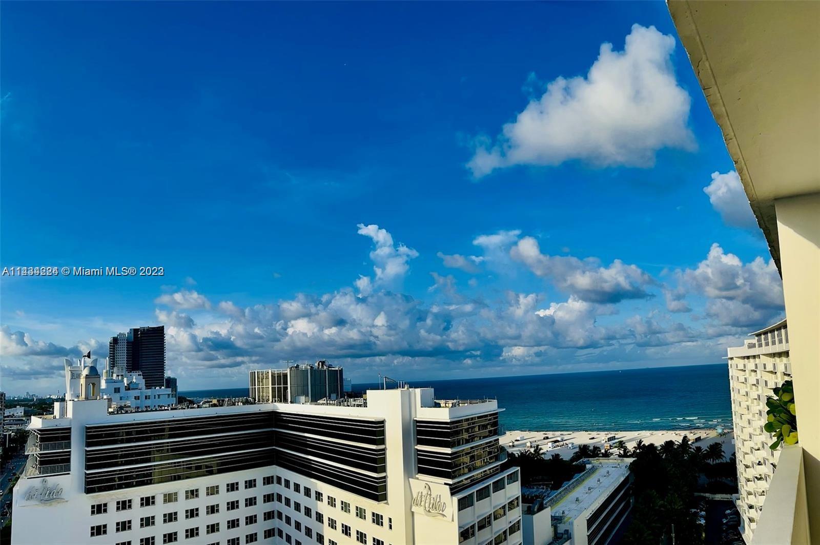 An elevated view shows a white hotel building overlooking the ocean and sandy beach — 100 Lincoln Rd # 1612, Miami Beach FL 33139, MIAMI BEACH, FL