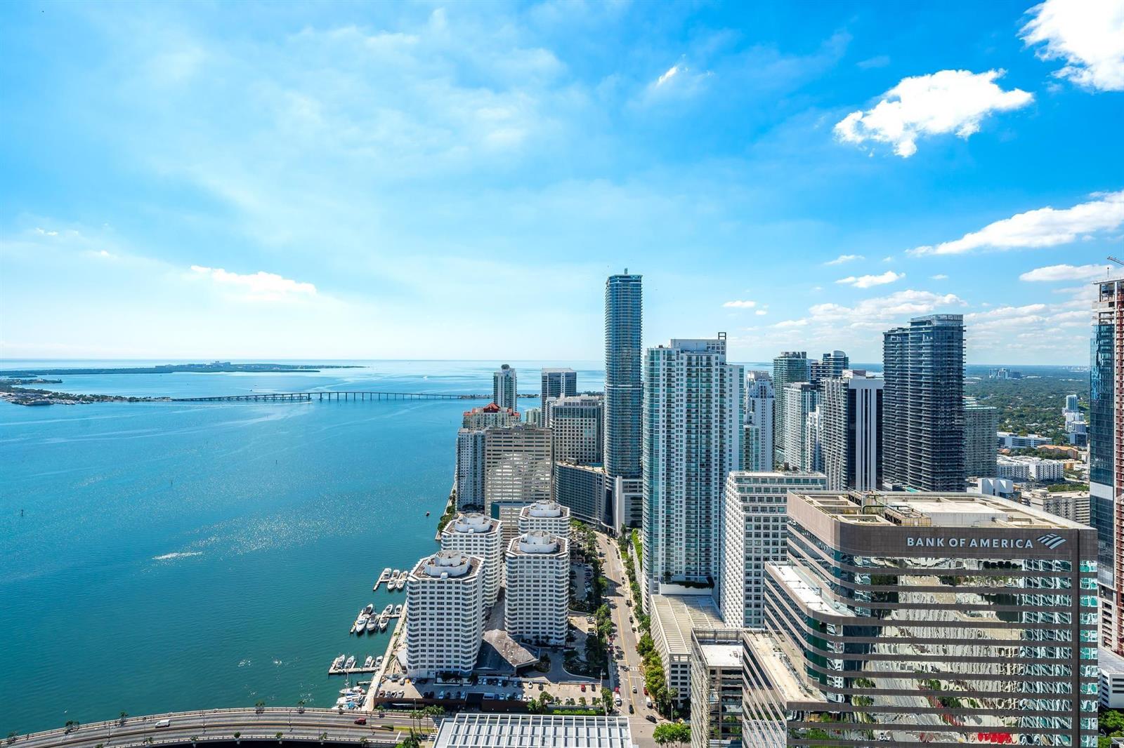 An aerial view of the Miami skyline featuring skyscrapers, the bay, and a bridge — 495 Brickell Avenue # 5605, Miami FL 33131, MIAMI, FL