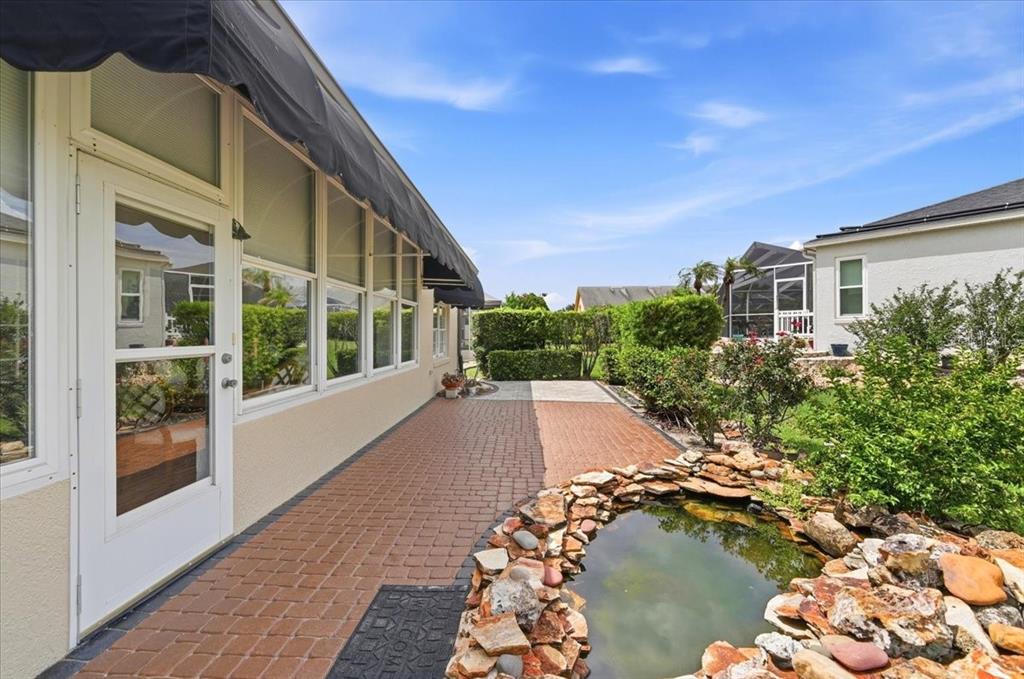An aerial view shows a single-story house with a paved driveway and a front lawn — 5767 SANDPIPERS DRIVE, LAKELAND, FL