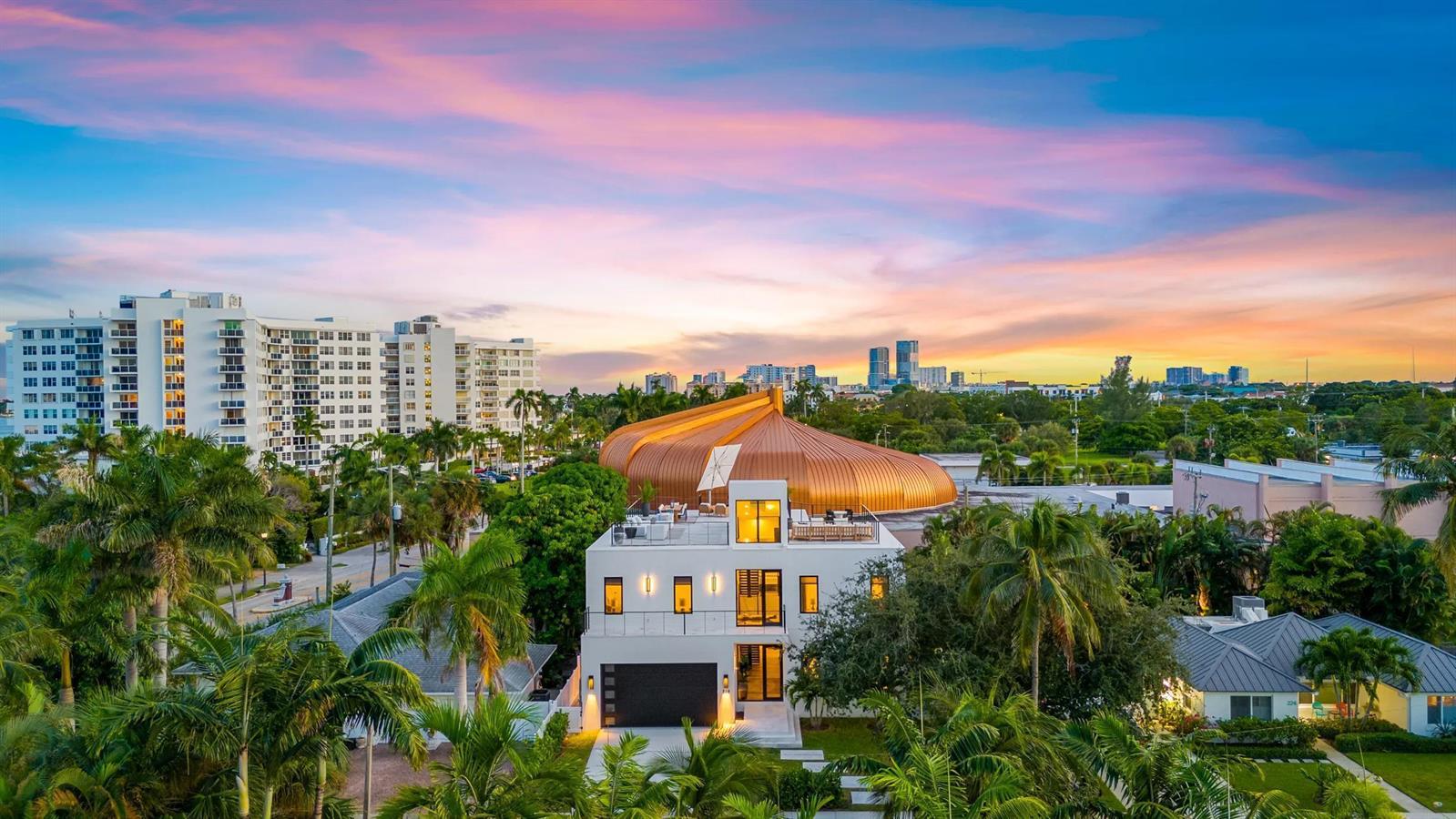 An aerial view of a modern white house with a large copper-colored dome roof nearby — 214 28th Street, West Palm Beach FL 33407, WEST PALM BEACH, FL