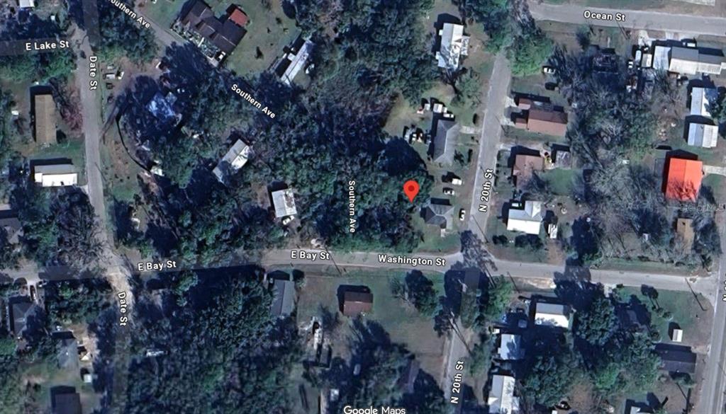 This is a satellite map view showing a residential lot marked with a red pin — 1964-2082 WASHINGTON ST, PALATKA, FL