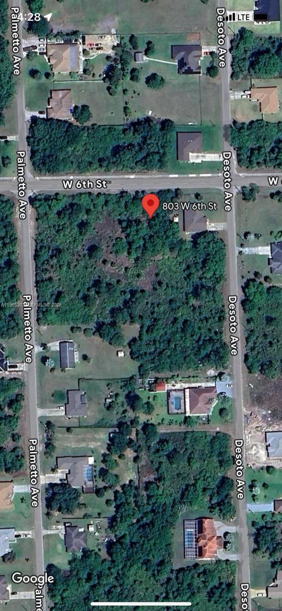 An aerial map view shows a wooded residential lot located between two streets — 803 W 6th St, Lehigh Acres FL 33792, LEHIGH ACRES, FL
