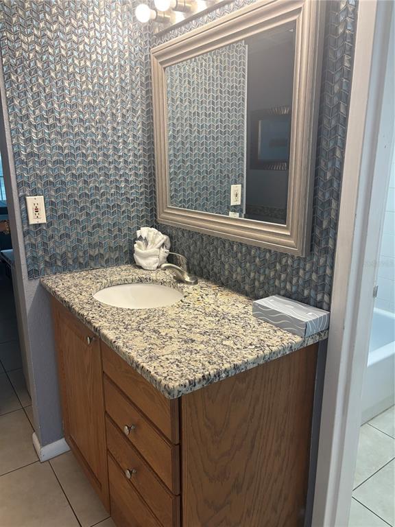 A gray hotel room door with an electronic lock and a room number sign — 9980 GULF BOULEVARD UNIT 317, ST PETERSBURG, FL