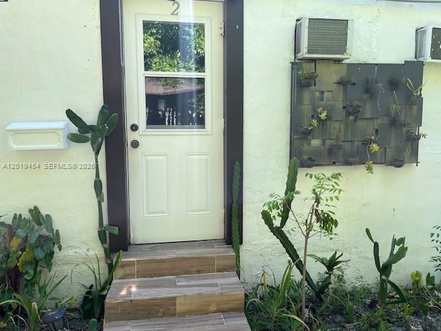 An exterior view of a doorway with a number two and a vertical wall planter — 410 NW 31st St # 2, Miami FL 33127, MIAMI, FL