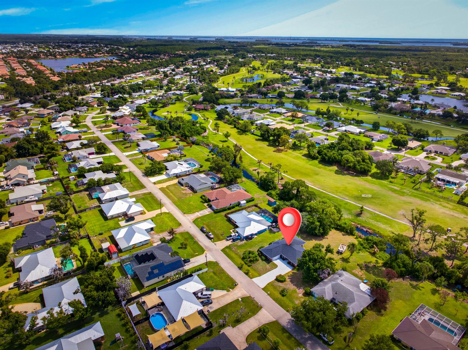 An aerial view shows a residential neighborhood with a red map pin marking a house — 5110 Eagle Drive, Fort Pierce FL 34951, FORT PIERCE, FL