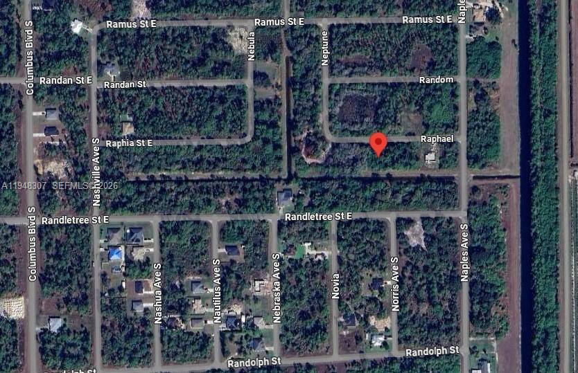 This is an aerial map showing a vacant lot marked with a red pin — 1238 RAPHAEL ST E, Lehigh Acres FL 33974, LEHIGH ACRES, FL
