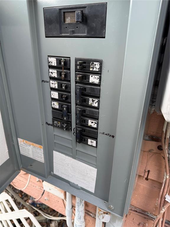 An open electrical breaker panel is mounted on an exterior wall — 3612 N 23RD STREET, TAMPA, FL