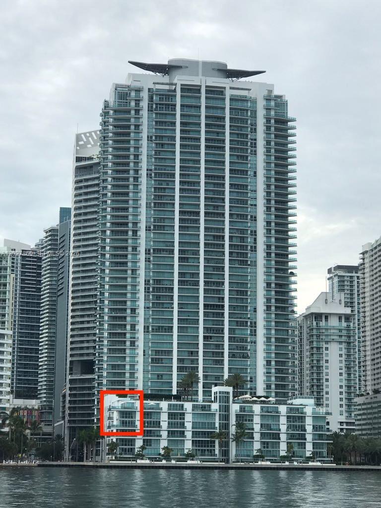 A tall residential skyscraper with a red box highlighting a lower-level balcony unit — 1331 Brickell Bay Dr # 48, Miami FL 33131, MIAMI, FL
