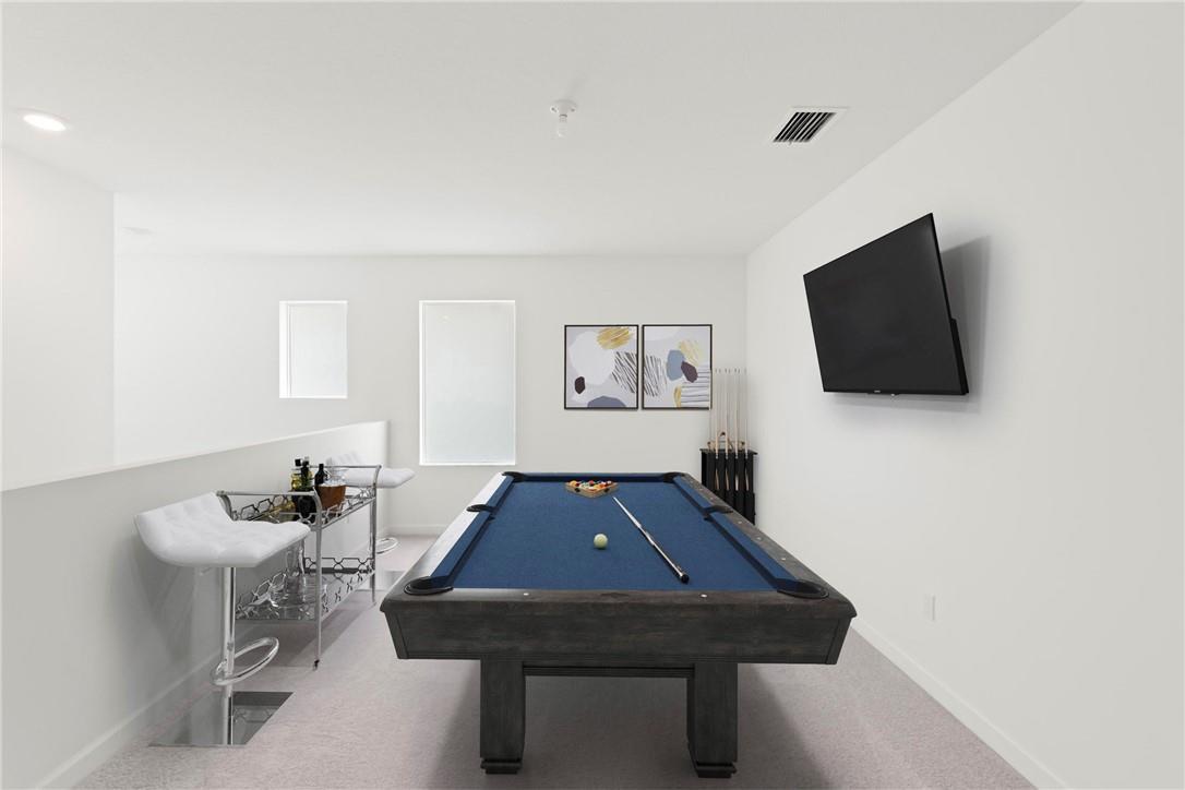 A game room features a blue pool table, a wall-mounted television, and a bar cart — 22974 Hillshire Road, Boca Raton FL 33433, BOCA RATON, FL