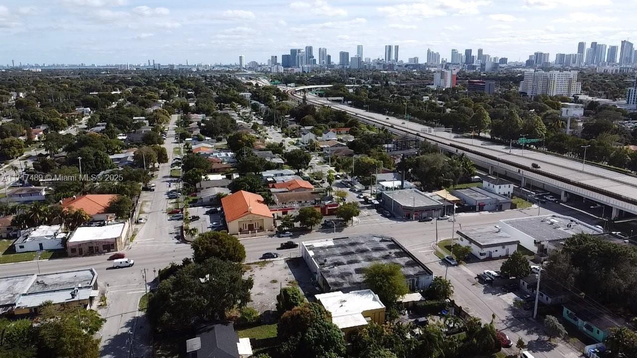 An aerial view shows a residential neighborhood with a church and a nearby elevated highway — 4120 NW 17th Ave, Miami FL 33142, MIAMI, FL