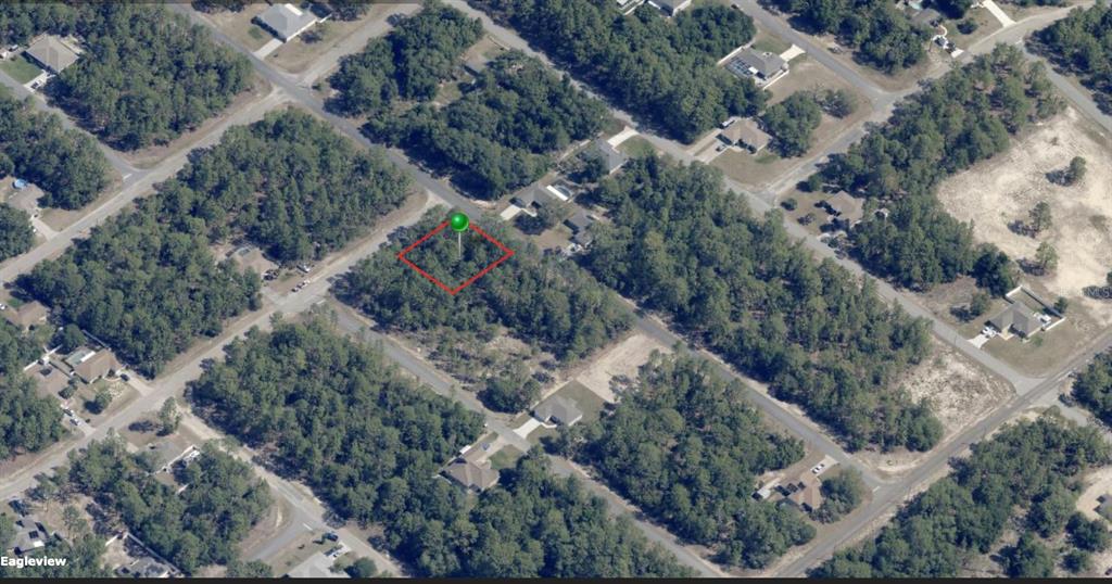 An aerial view shows a vacant, wooded residential lot outlined in red with a green marker — 9432 N CHERRY LAKE DRIVE, CITRUS SPRINGS, FL