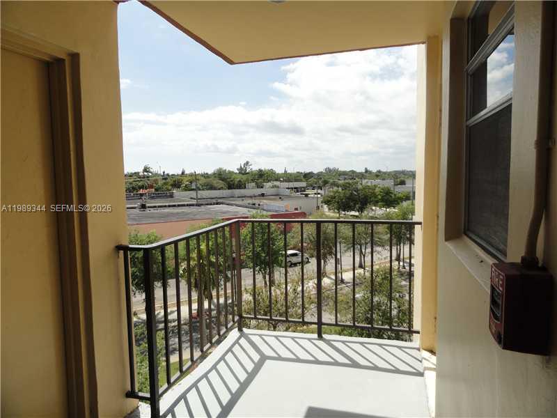 A waiting area features two black armchairs, a side table, and marble-patterned wall panels — 16410 Miami Dr # 504, North Miami Beach FL 33162, NORTH MIAMI BEACH, FL