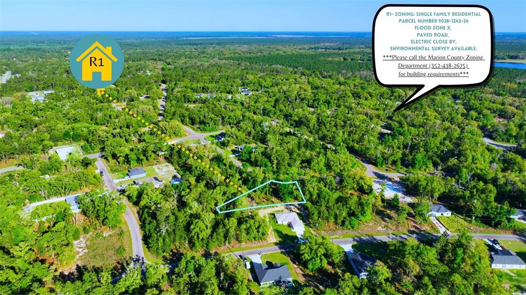 An aerial view shows a wooded residential lot outlined in blue within a rural neighborhood — TBD FISHER LN WAY, OCKLAWAHA, FL