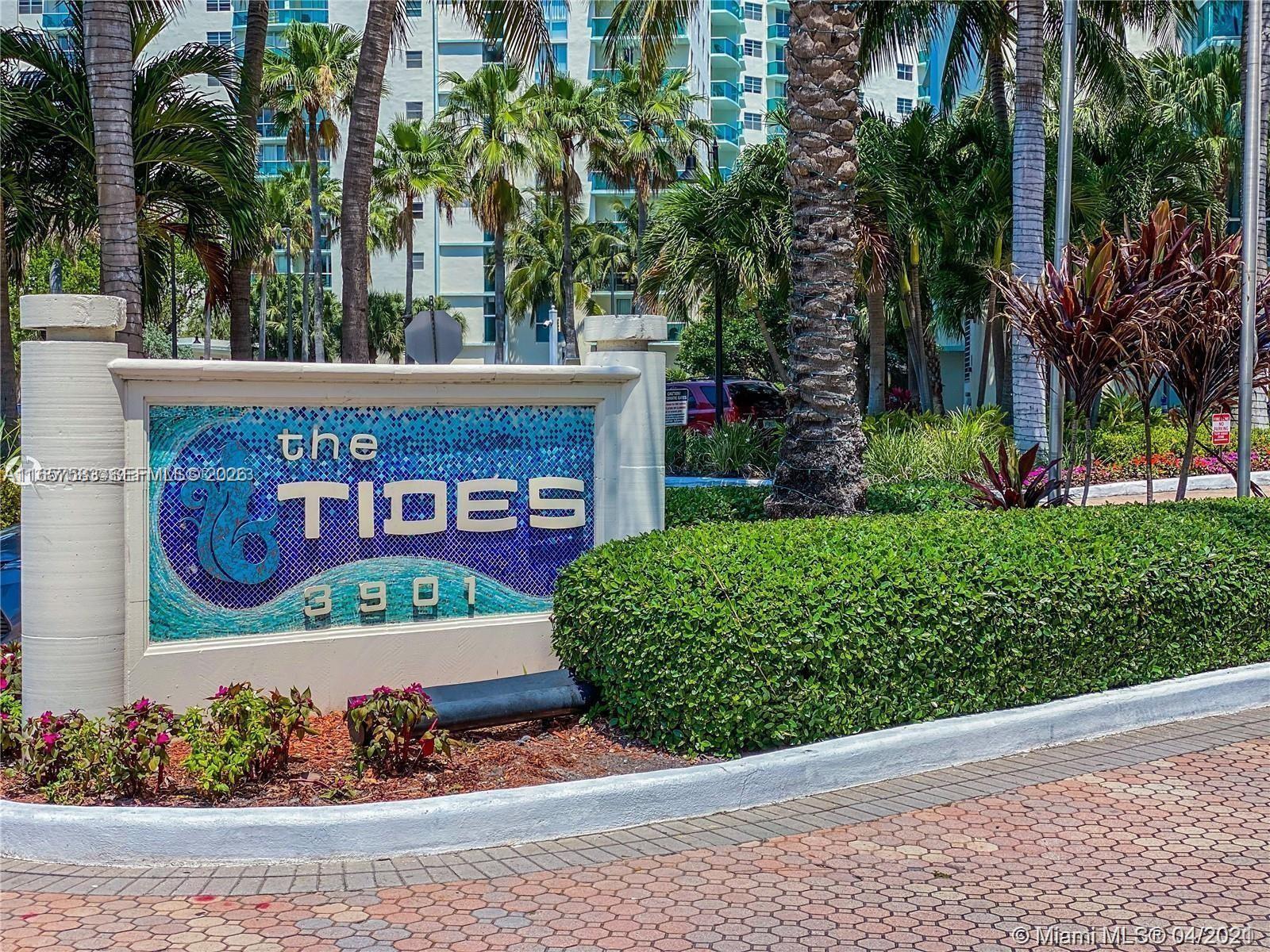 A sign for The Tides stands in front of a building with palm trees — 3801 S Ocean Dr # 12M, Hollywood FL 33019, HOLLYWOOD, FL