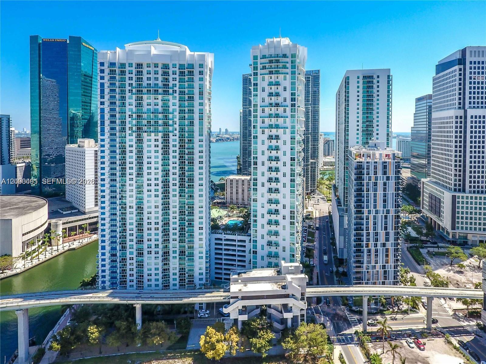 An aerial view of high-rise apartment buildings in downtown Miami with a monorail track below — 31 SE 5th St # 4212, Miami FL 33131, MIAMI, FL