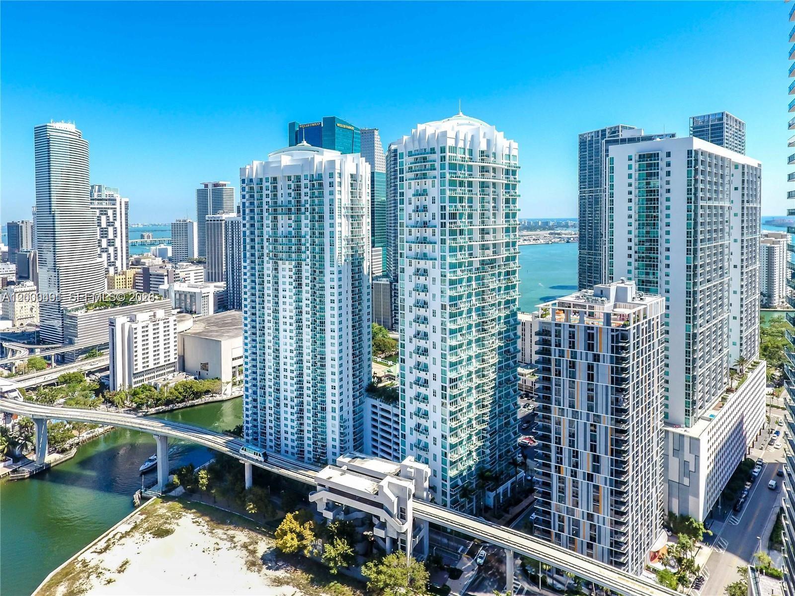 An aerial view of high-rise apartment buildings in Miami with a bridge and water nearby — 31 SE 5th St # 4212, Miami FL 33131, MIAMI, FL