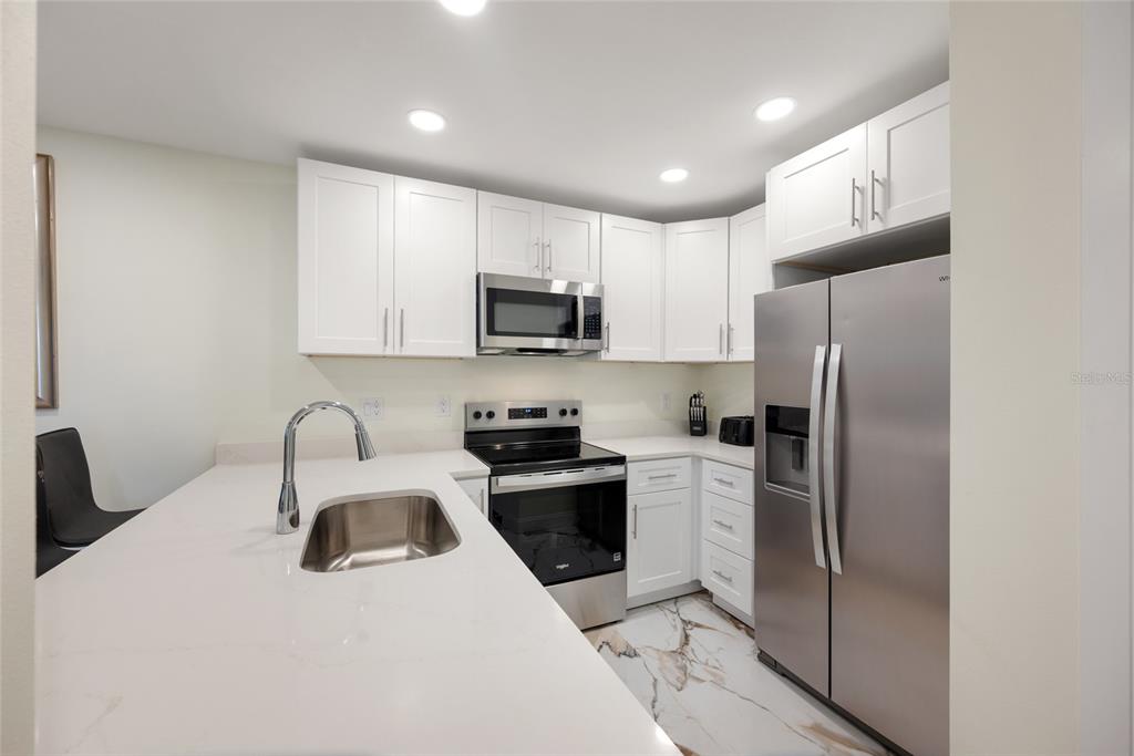 240 MEDALLION BOULEVARD UNIT A, MADEIRA BEACH, FL — photo 5 of 30
