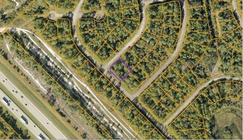 An aerial map view shows a vacant residential lot outlined in purple within a neighborhood — JUBILEE CIRCLE, NORTH PORT, FL