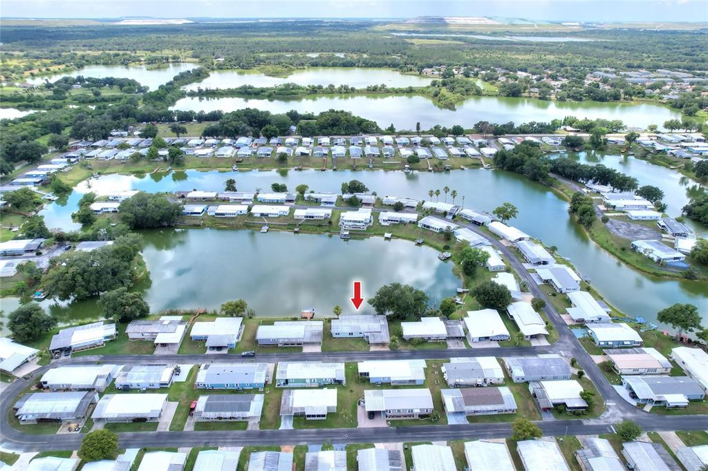 An aerial view shows a mobile home community situated along a series of small lakes — 2055 S FLORAL AVENUE UNIT 262, BARTOW, FL